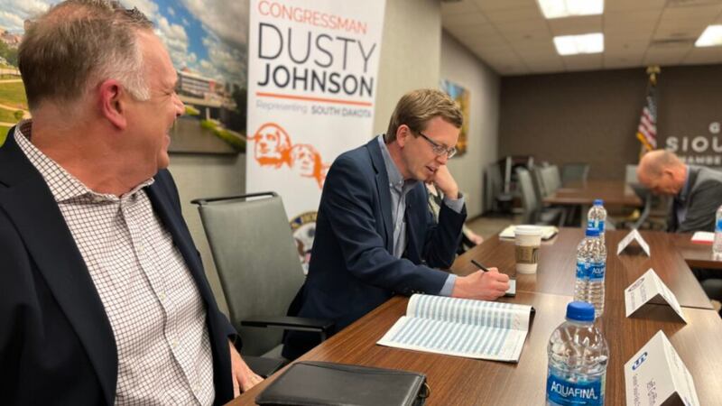 Jeff Griffin of the Greater Sioux Falls Chamber of Commerce, left, talks with U.S. Rep. Dusty...