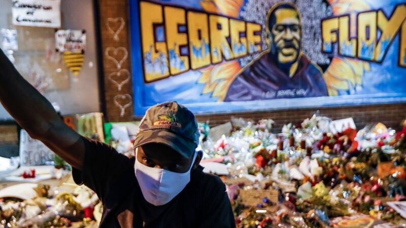 Protesters gather at a memorial for George Floyd where he died outside Cup Foods on East 38th...